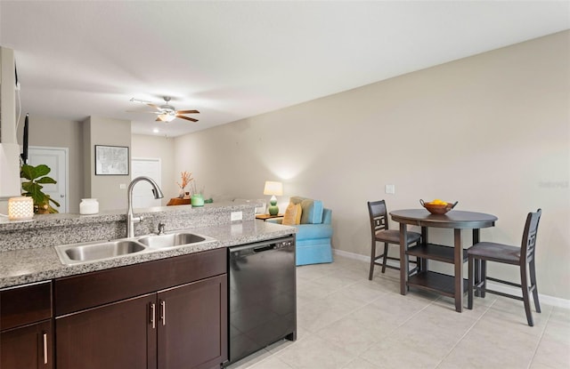 kitchen with dishwasher, dark brown cabinetry, sink, ceiling fan, and light tile patterned flooring