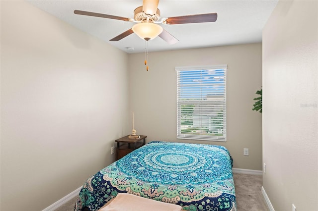 bedroom with ceiling fan and carpet flooring