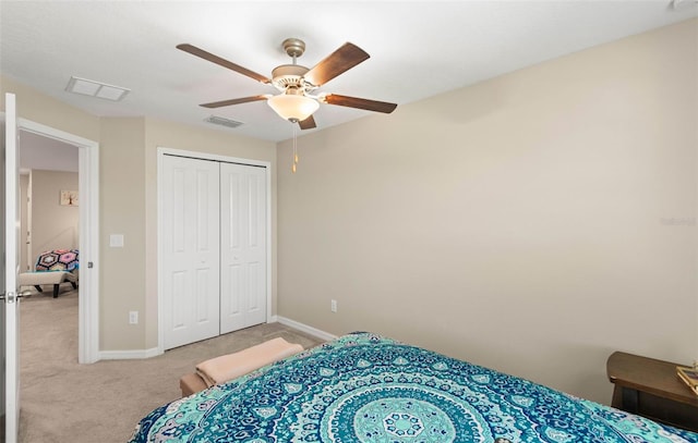 carpeted bedroom with a closet and ceiling fan