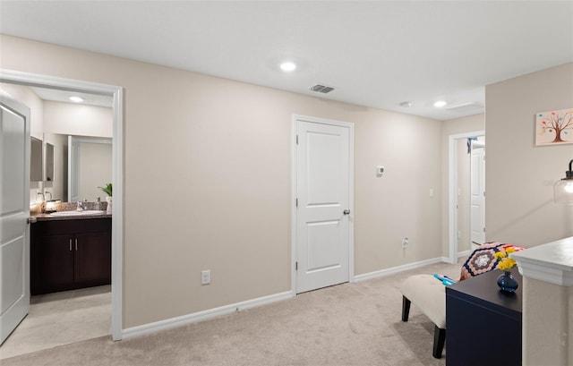 7203 Sweet Alyssum Ct, Tampa, FL 33619 - interior space featuring a sink, baseboards, light colored carpet, visible vents, and recessed lighting
