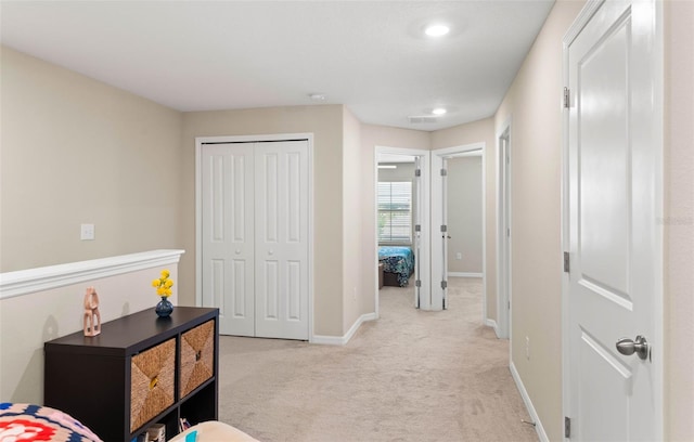 7203 Sweet Alyssum Ct, Tampa, FL 33619 - bedroom featuring a closet, baseboards, and light colored carpet