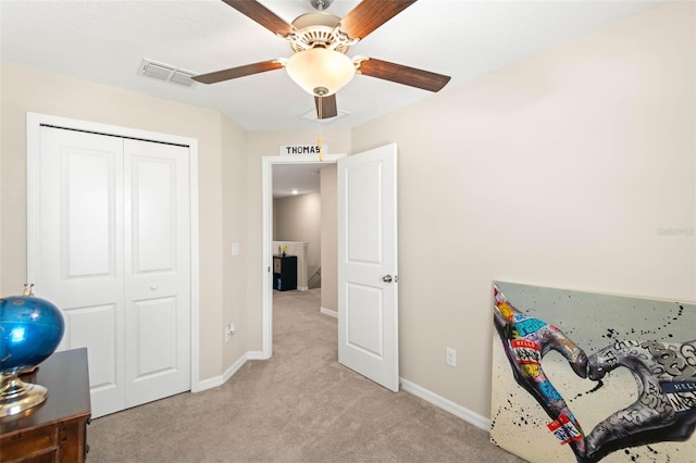 recreation room featuring light colored carpet and ceiling fan