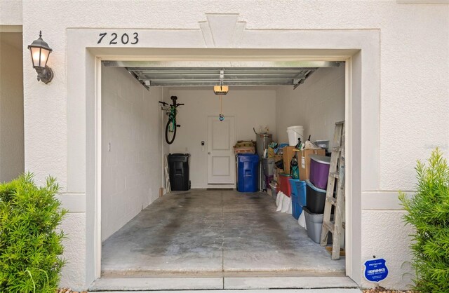 7203 Sweet Alyssum Ct, Tampa, FL 33619 - garage featuring a garage door opener