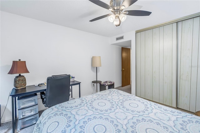 bedroom featuring carpet floors, ceiling fan, and a closet