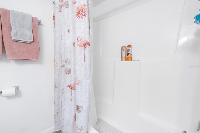 bathroom featuring curtained shower