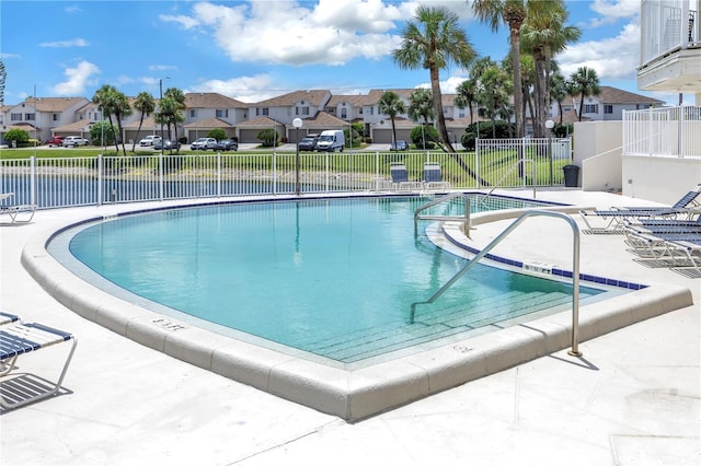 view of swimming pool featuring a patio area