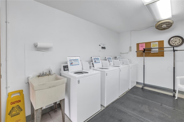 laundry area featuring separate washer and dryer and sink