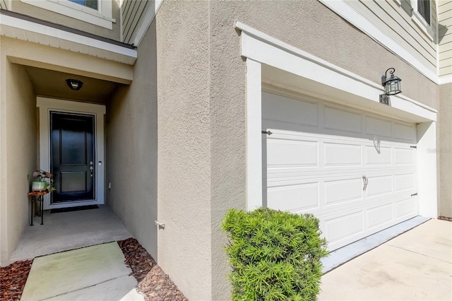 property entrance with a garage