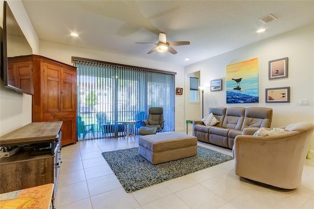 living room with ceiling fan and light tile patterned floors