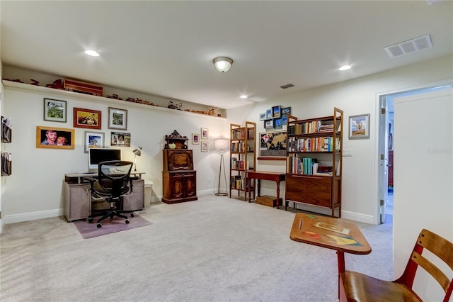 office space with light colored carpet