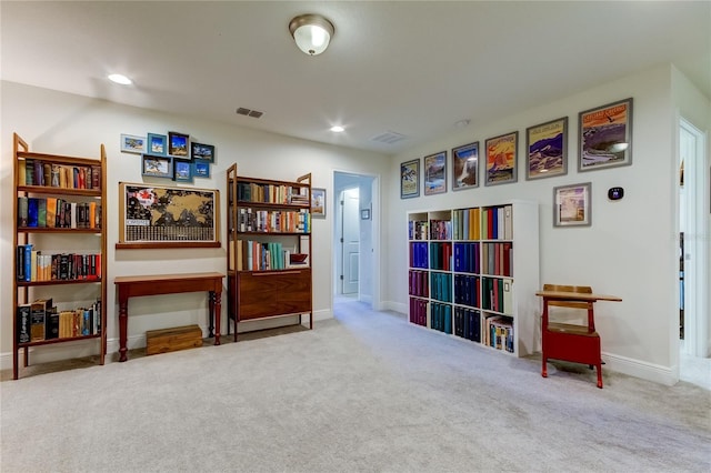 interior space featuring light carpet