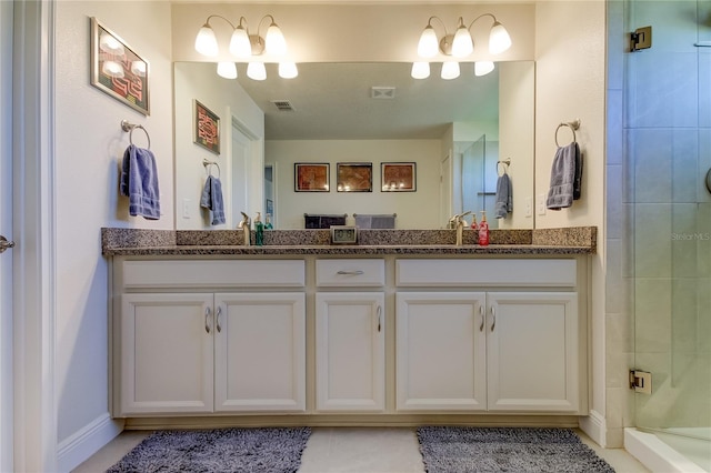 bathroom with walk in shower and vanity