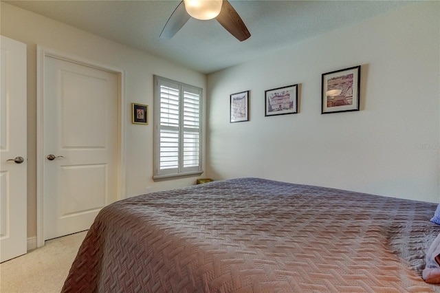 bedroom featuring ceiling fan and light colored carpet