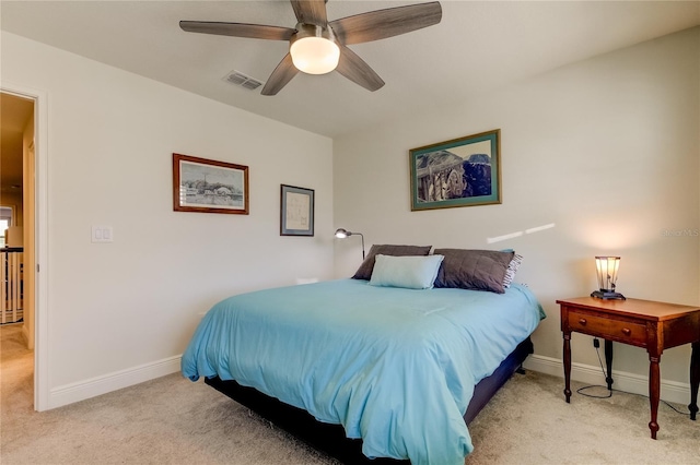 bedroom featuring light carpet and ceiling fan