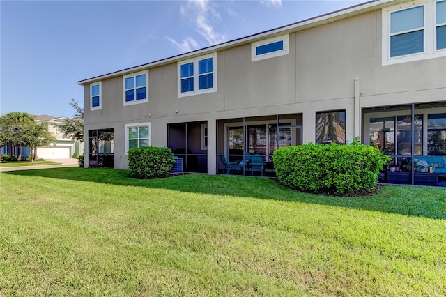 rear view of property featuring a yard