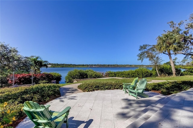 view of patio with a water view