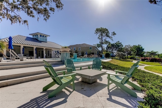 view of property's community featuring a patio