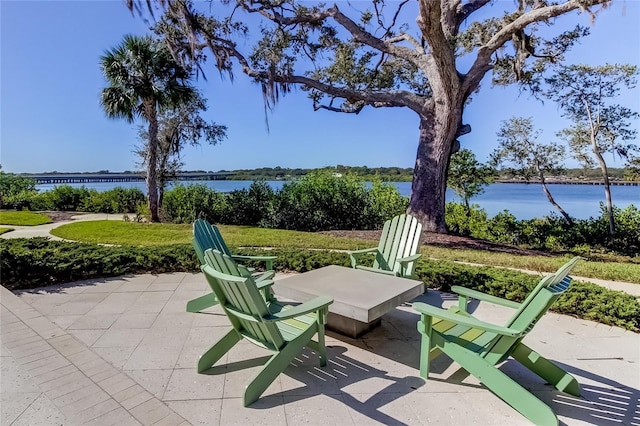 view of patio with a water view