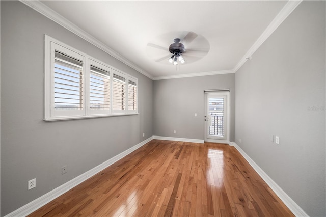 spare room with light hardwood / wood-style flooring, ceiling fan, and ornamental molding