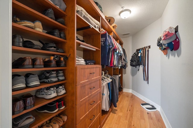 walk in closet featuring light wood-type flooring