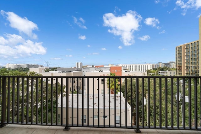 view of gate with a city view