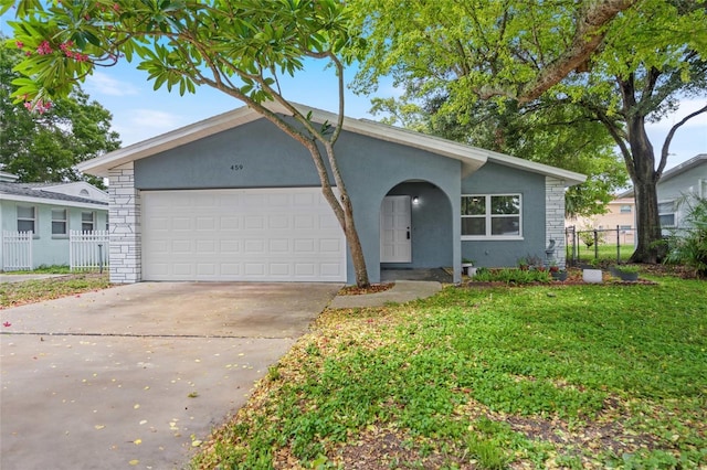 single story home featuring a garage and a front lawn