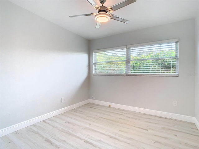 unfurnished room featuring light wood-type flooring and ceiling fan