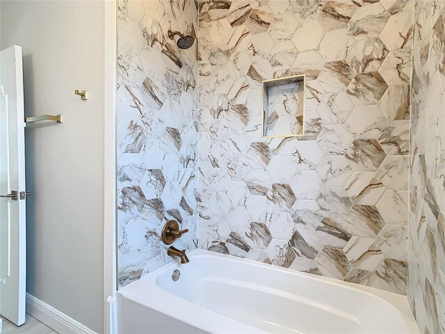 bathroom with tiled shower / bath combo