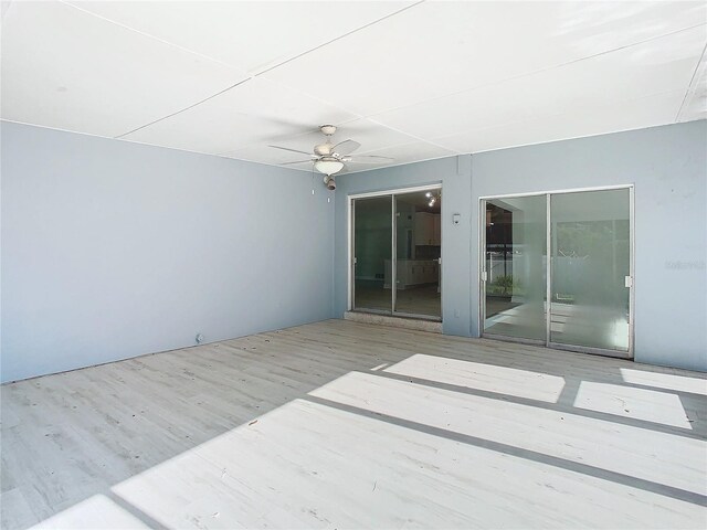 view of patio / terrace featuring ceiling fan and a deck