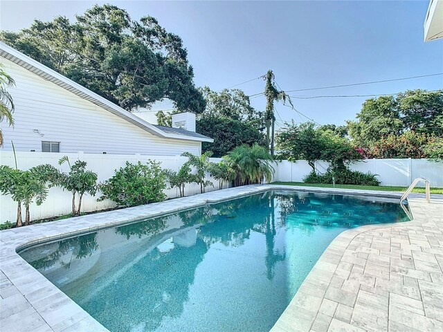 view of pool featuring a fenced backyard, a fenced in pool, and a patio