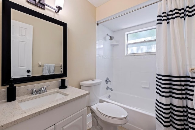 full bathroom with vanity, shower / bath combo, and toilet