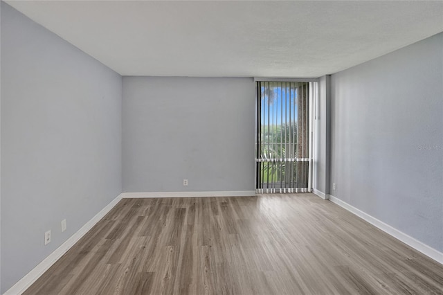 spare room with light wood-type flooring