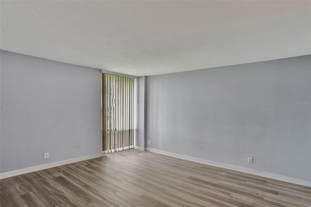 unfurnished room featuring light hardwood / wood-style floors