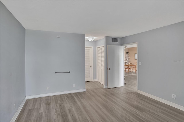 empty room with light wood-type flooring