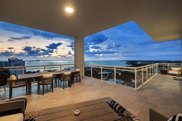 exterior space with a balcony and a water view