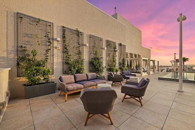 patio terrace at dusk with an outdoor hangout area