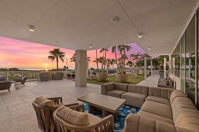 patio terrace at dusk with an outdoor hangout area