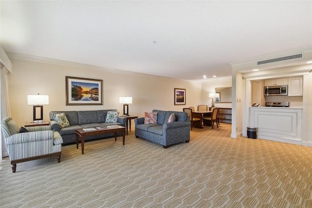 carpeted living room featuring ornamental molding