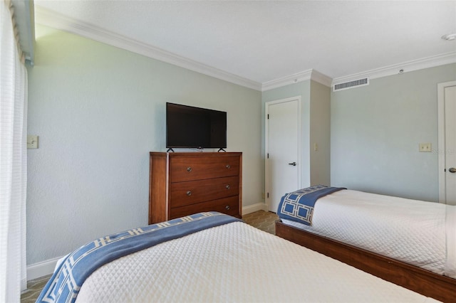 bedroom with crown molding