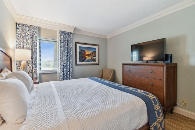 bedroom featuring crown molding and a textured ceiling