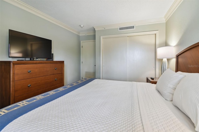 bedroom featuring ornamental molding and a closet