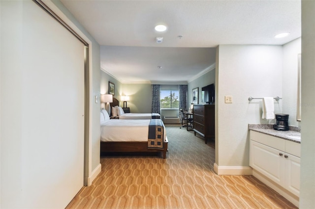 bedroom featuring crown molding