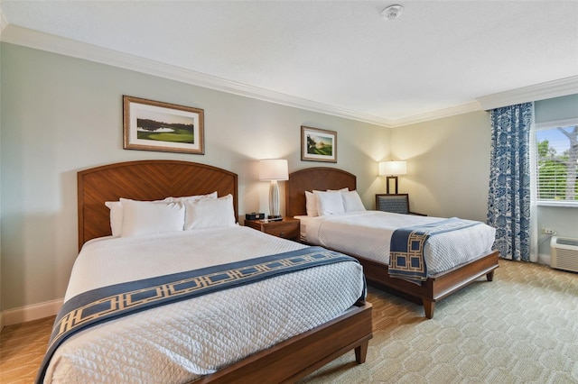 bedroom featuring a wall mounted air conditioner and crown molding