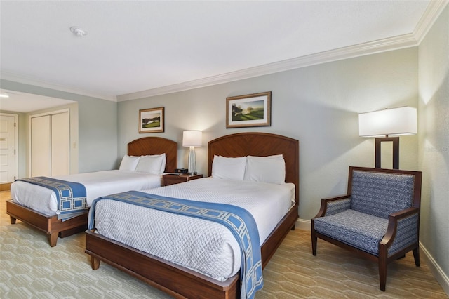 bedroom featuring ornamental molding and a closet