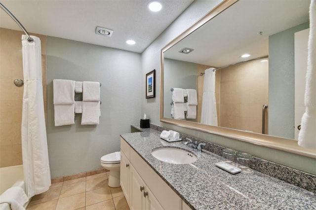 full bathroom featuring toilet, shower / bath combo with shower curtain, tile patterned flooring, and vanity