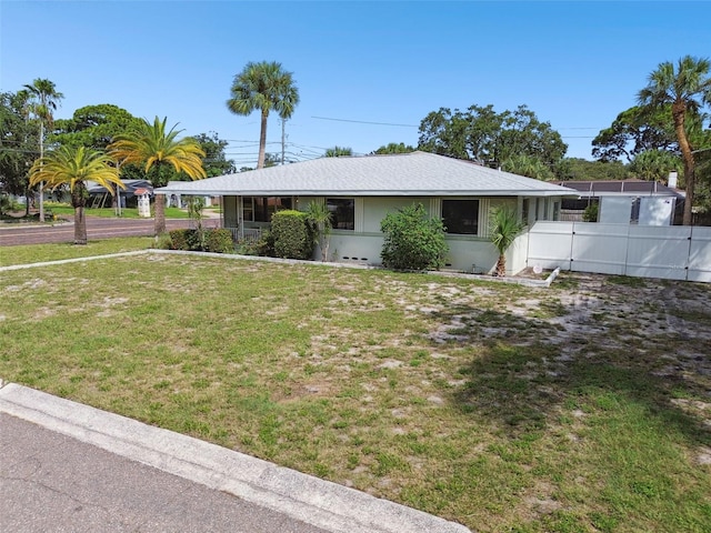 single story home with a front lawn