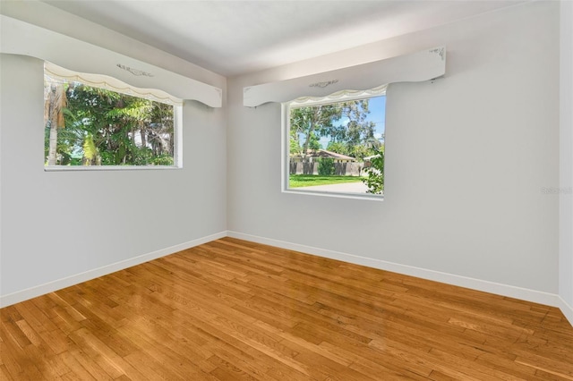 empty room with light hardwood / wood-style floors