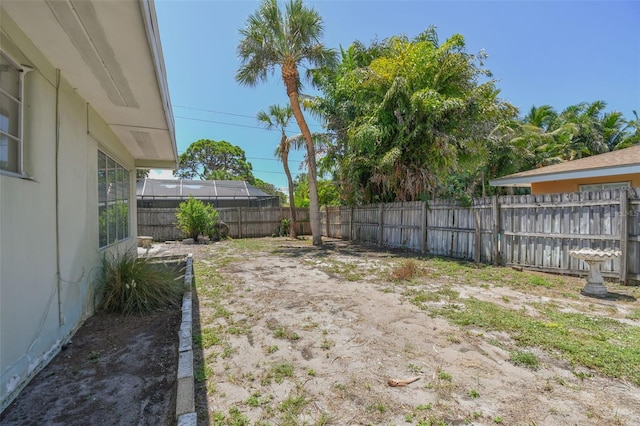 view of yard with a lanai