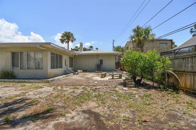 back of property featuring a patio