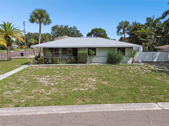 ranch-style home with a porch and a front lawn